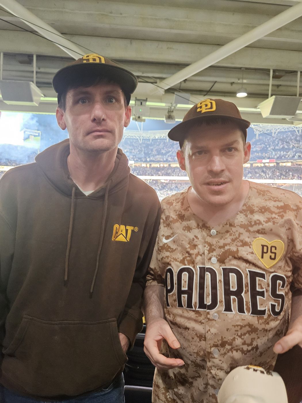 Two members of the Big Moves family in Padres gear at Petco Park