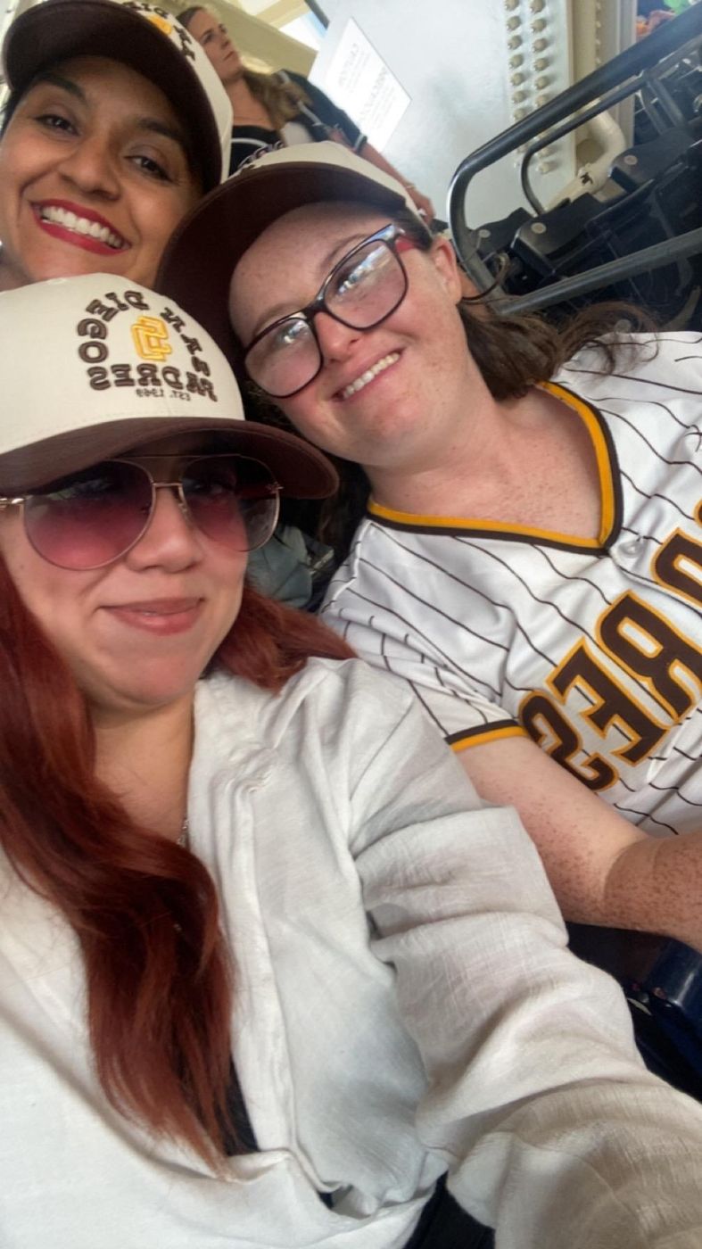 Three members of the Big Moves family taking a selfie at a Padres game